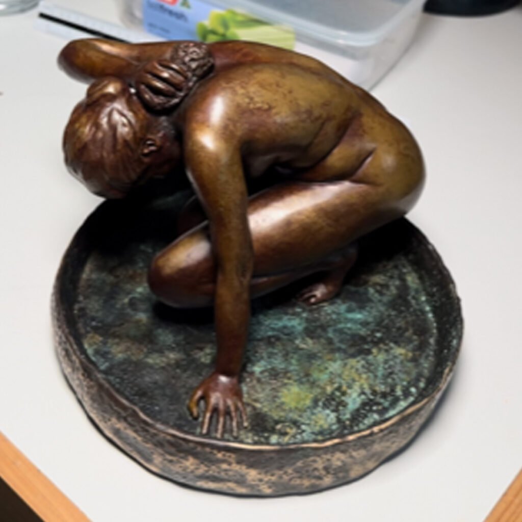 A bronze casting of a female figure sculpture