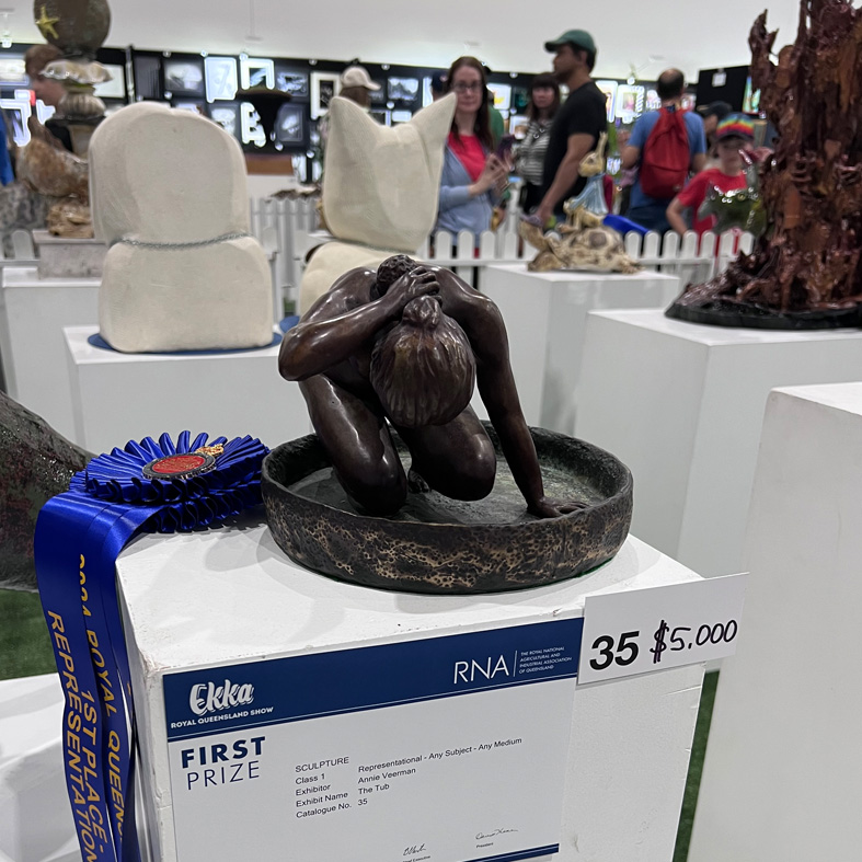 Photo of a bronze sculpture of a female figure