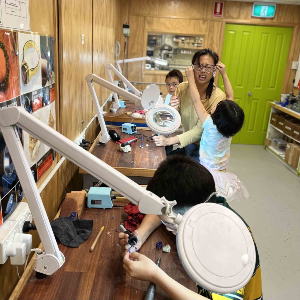 Kids and mother in a jewellery studio